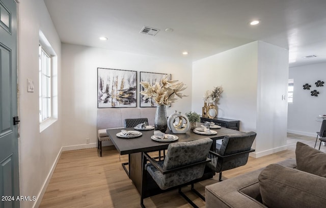 dining area with light hardwood / wood-style flooring