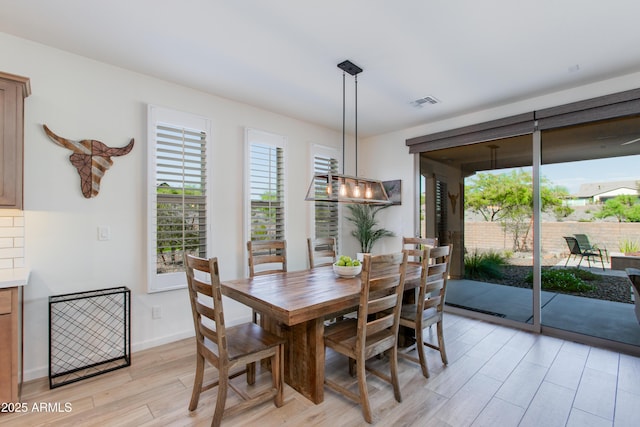 4350 Stage Stop Way, Wickenburg, AZ 85390 - dining room featuring light wood-style floors and baseboards