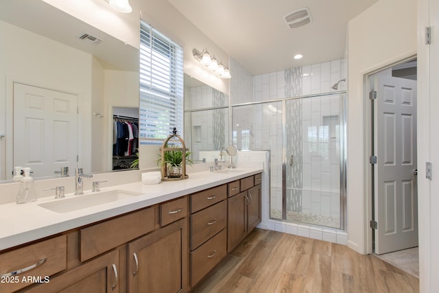 4350 Stage Stop Way, Wickenburg, AZ 85390 - full bathroom with wood finished floors, double vanity, a shower stall, and a walk in closet