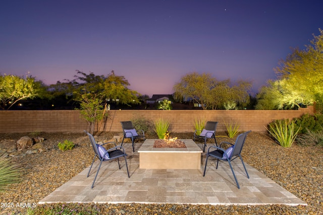 4350 Stage Stop Way, Wickenburg, AZ 85390 - patio terrace at dusk featuring a fenced backyard, a fire pit, and a patio area