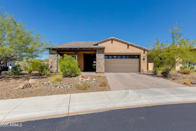 4350 Stage Stop Way, Wickenburg, AZ 85390 - view of front of house featuring stucco siding, decorative driveway, and a garage