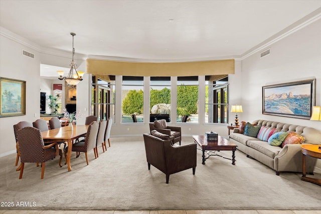 living room with light colored carpet, an inviting chandelier, and ornamental molding