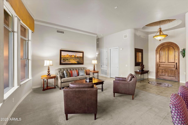 carpeted living room featuring plenty of natural light