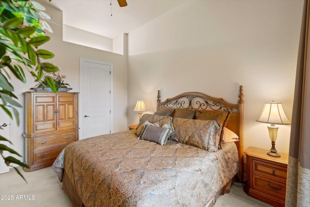 bedroom with light carpet and ceiling fan