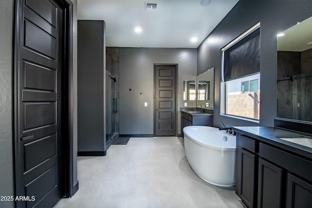 bathroom with independent shower and bath, vanity, and concrete floors