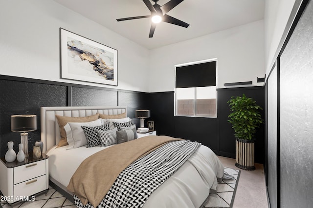 bedroom with ceiling fan and light carpet