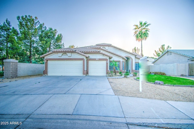 836 N Sinova Ave, Gilbert, AZ 85234 - view of front of house with an attached garage, stucco siding, concrete driveway, and a tiled roof
