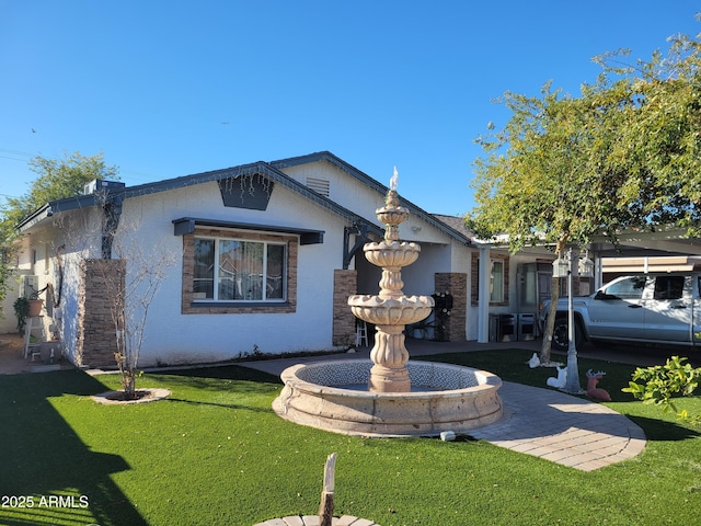 view of front facade with a front lawn