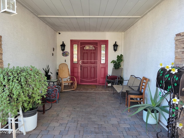 property entrance featuring covered porch