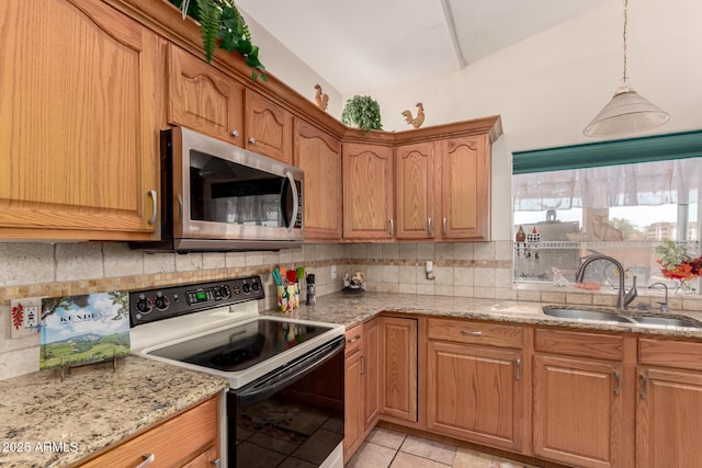 kitchen with light tile patterned flooring, sink, light stone counters, electric range, and backsplash