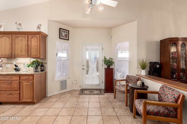 tiled entrance foyer featuring ceiling fan