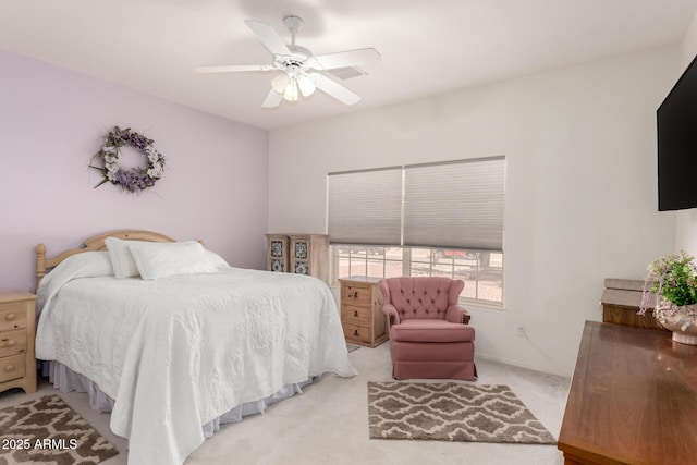 bedroom featuring light carpet and ceiling fan