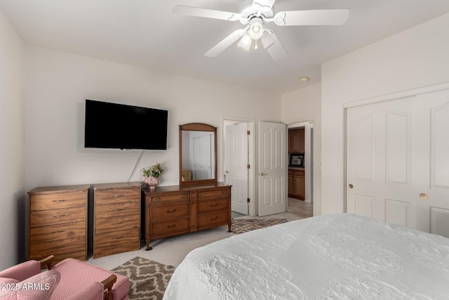 carpeted bedroom with a closet and ceiling fan