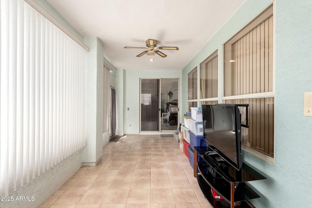 corridor with light tile patterned flooring