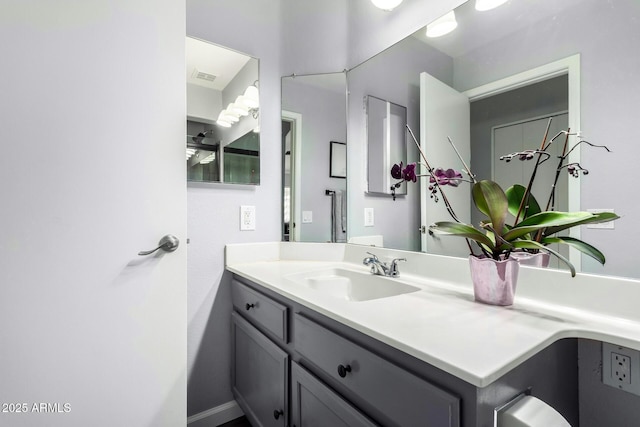 bathroom featuring vanity and visible vents