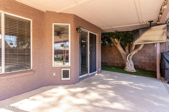 view of patio / terrace featuring fence