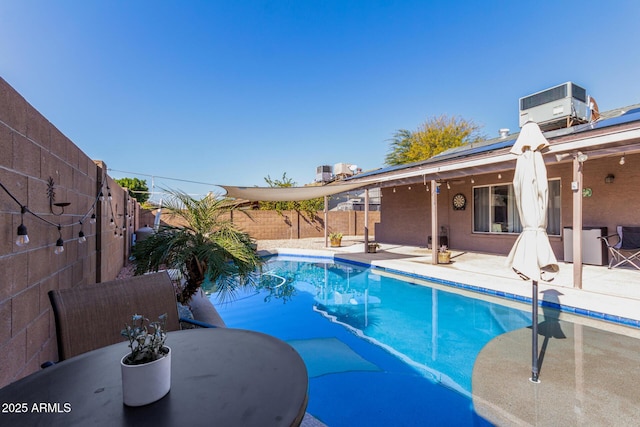 view of swimming pool featuring a fenced in pool, central AC unit, outdoor dining area, a fenced backyard, and a patio area