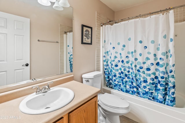 full bathroom with shower / tub combo, vanity, and toilet