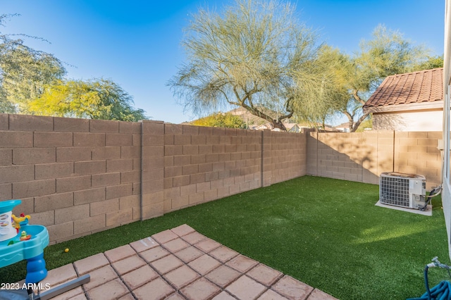 view of yard featuring a patio and cooling unit