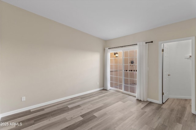 unfurnished room featuring light wood-type flooring