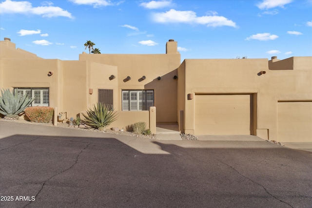 adobe home with a garage