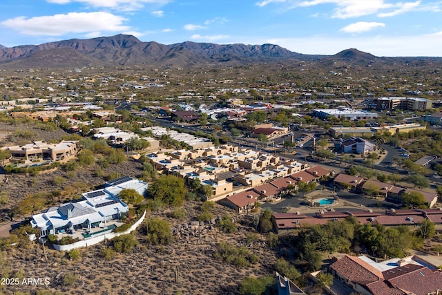 birds eye view of property with a mountain view