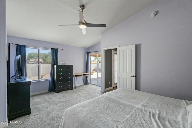 bedroom featuring multiple windows, lofted ceiling, light colored carpet, and ceiling fan