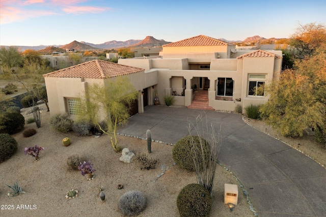 mediterranean / spanish-style home with a mountain view