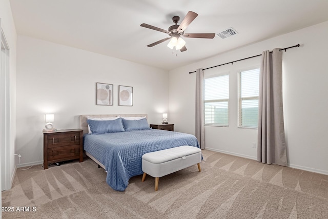 5875 N 195th Dr, Litchfield Park, AZ 85340 - bedroom with light colored carpet, visible vents, ceiling fan, and baseboards