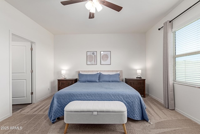 5875 N 195th Dr, Litchfield Park, AZ 85340 - bedroom featuring multiple windows, light carpet, and baseboards
