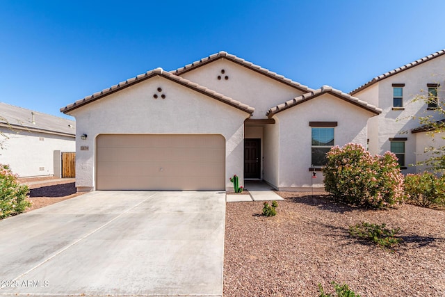 5875 N 195th Dr, Litchfield Park, AZ 85340 - mediterranean / spanish-style home with a garage, concrete driveway, a tiled roof, and stucco siding