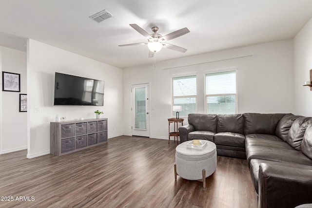 5875 N 195th Dr, Litchfield Park, AZ 85340 - living area with a ceiling fan, wood finished floors, visible vents, and baseboards
