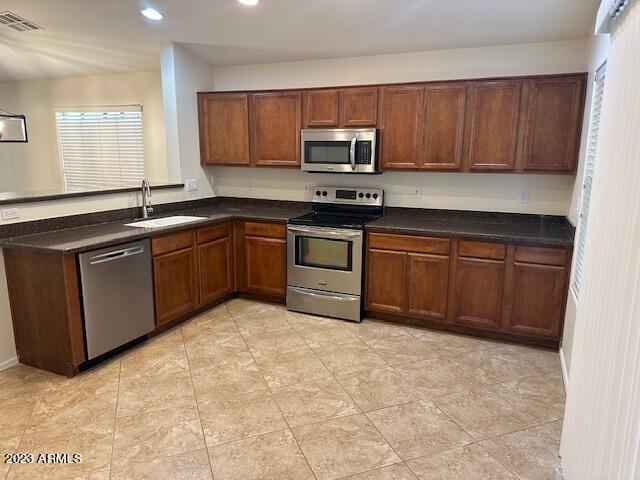 kitchen with sink and stainless steel appliances