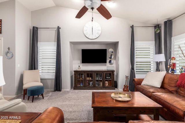 carpeted living room featuring lofted ceiling and ceiling fan