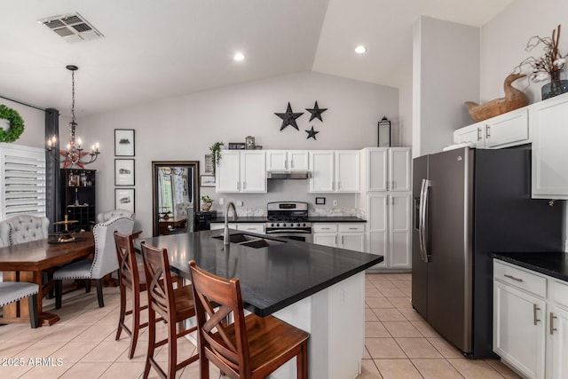 kitchen with visible vents, appliances with stainless steel finishes, light tile patterned flooring, a sink, and under cabinet range hood