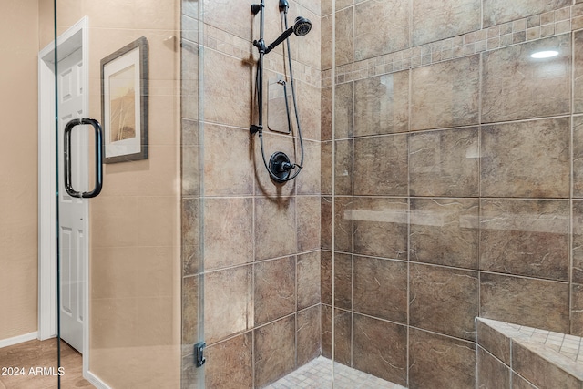 bathroom featuring an enclosed shower