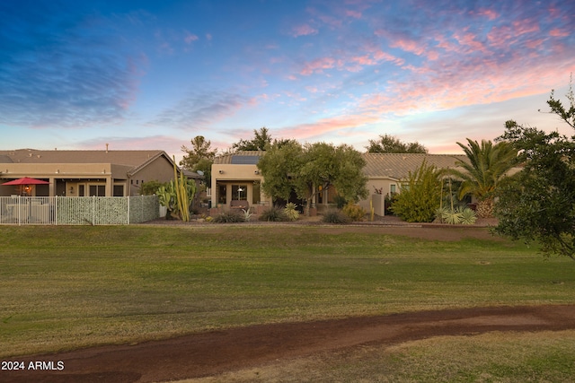 pueblo-style home featuring a yard