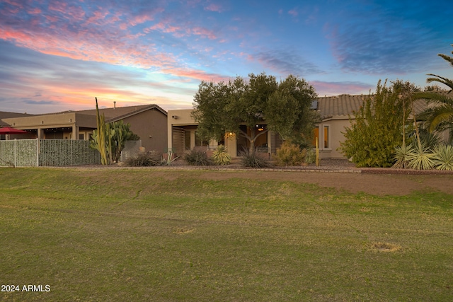 view of front of house with a yard