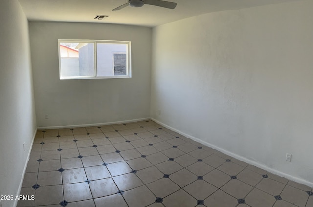 unfurnished room featuring a ceiling fan, baseboards, and visible vents