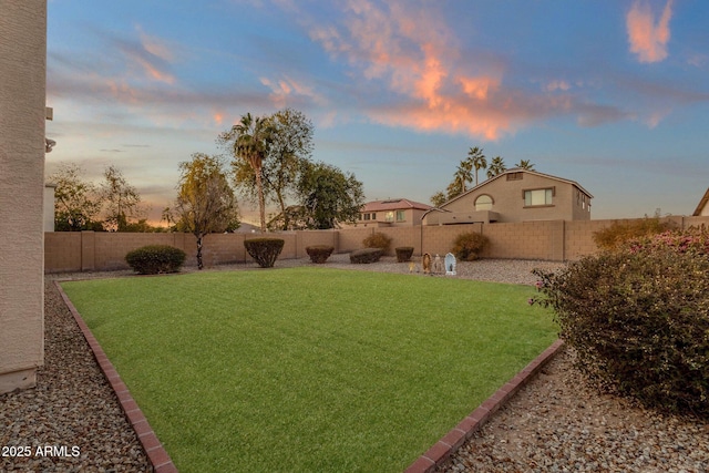 view of yard at dusk