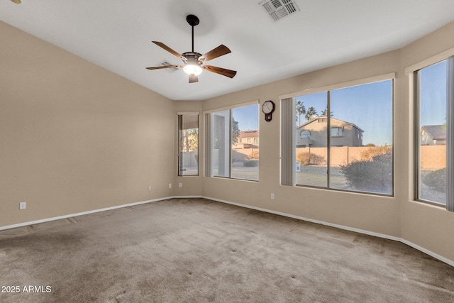 spare room featuring ceiling fan and carpet