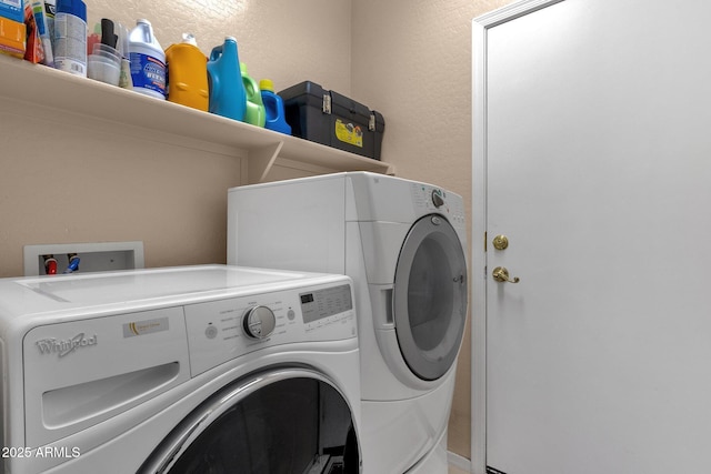 washroom with washer and clothes dryer