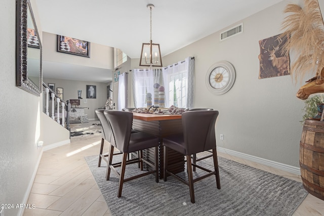 dining area featuring an inviting chandelier