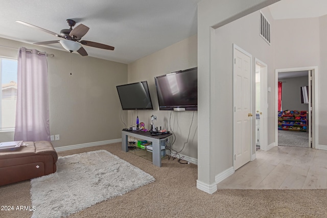 living room with light carpet and ceiling fan