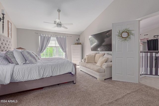 bedroom with lofted ceiling, ceiling fan, and carpet flooring