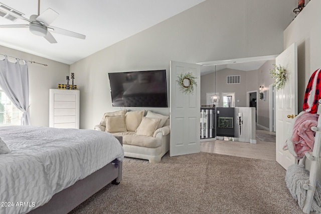 bedroom featuring carpet flooring, vaulted ceiling, and ceiling fan