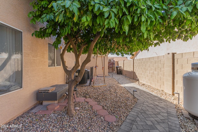 view of yard with a patio and central AC