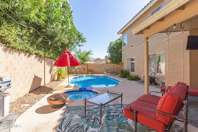 view of pool featuring a patio