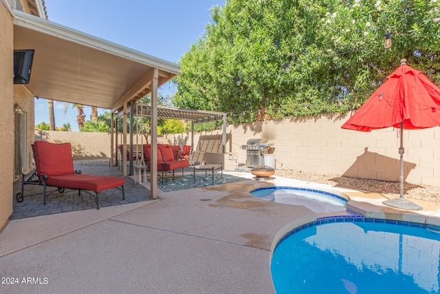 view of pool with a patio and a jacuzzi