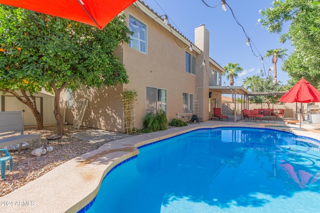 view of pool featuring a patio